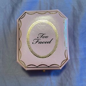 Too faced diamond fire highlighter, lightly swatched